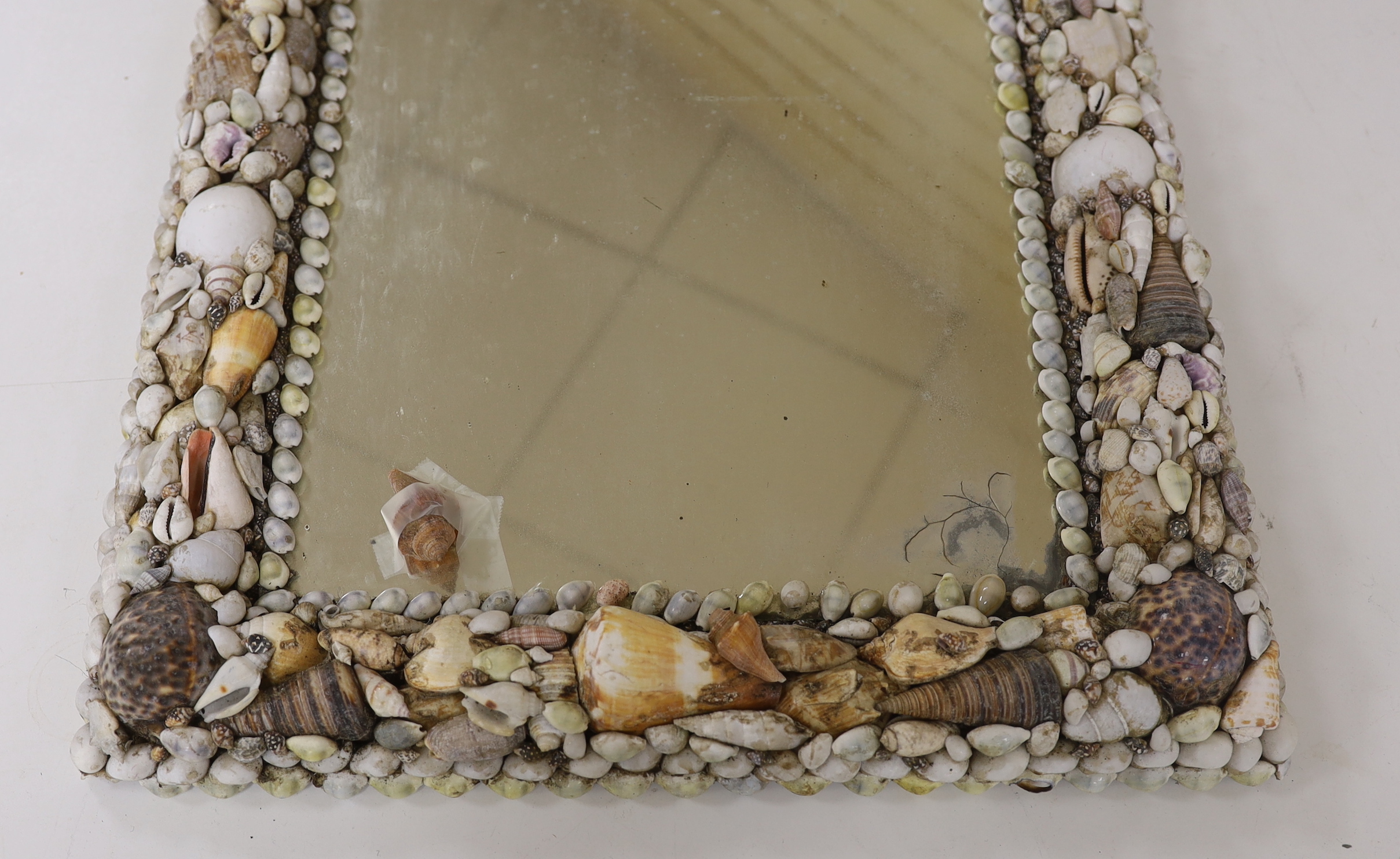 A shellwork framed wall mirror, 63x50cm